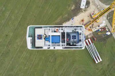 A bird's eye view of an open nacelle of a wind turbine without hub and rotors.
